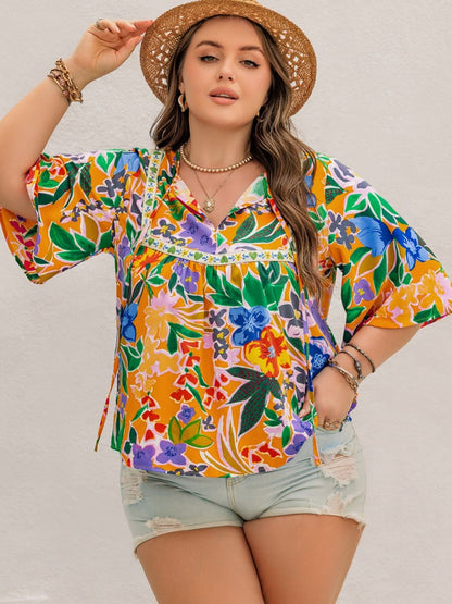 Plus Size Printed Tie Neck Half Sleeve Blouse